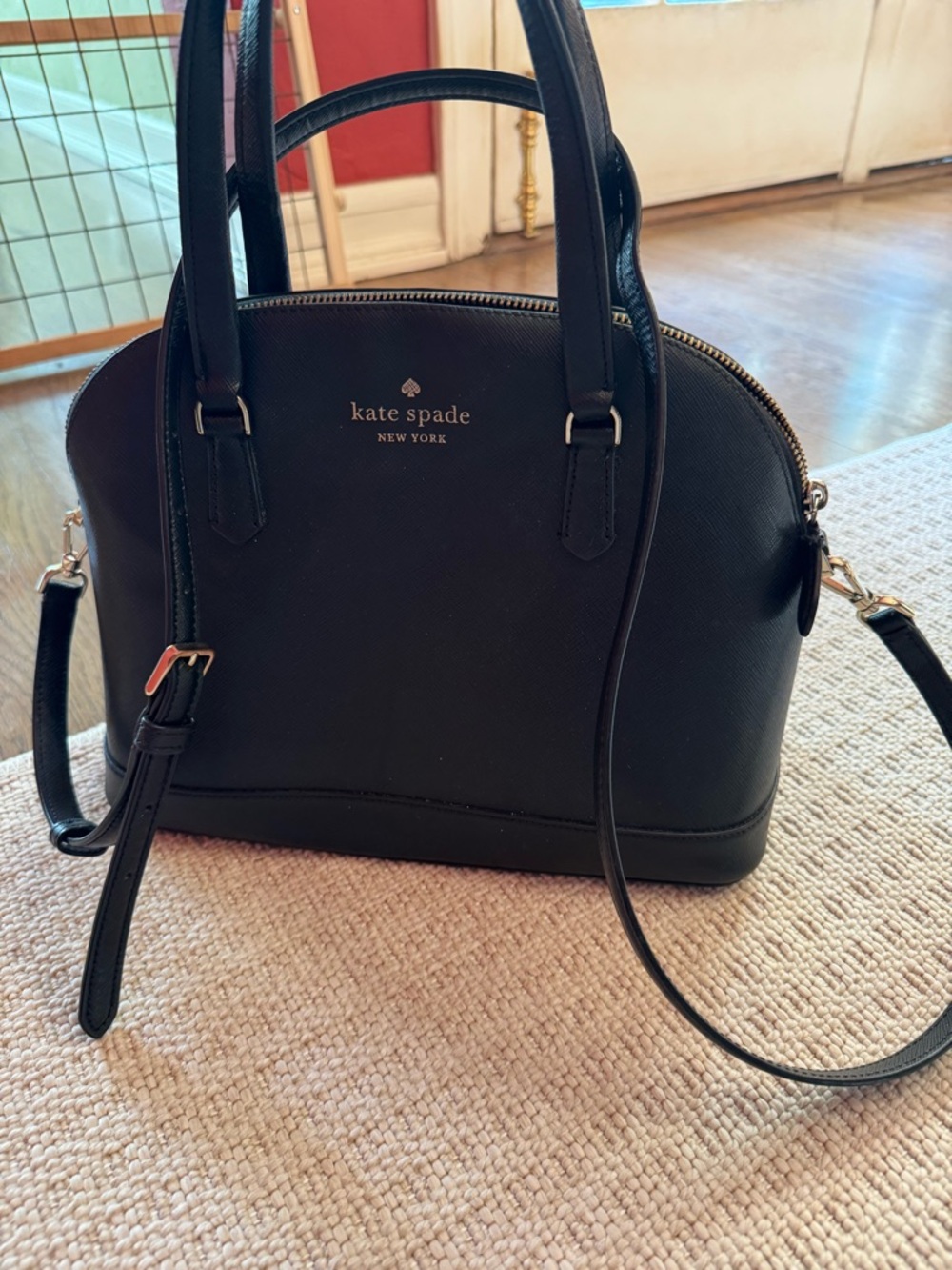 kate spade black dome satchel with gold-tone logo